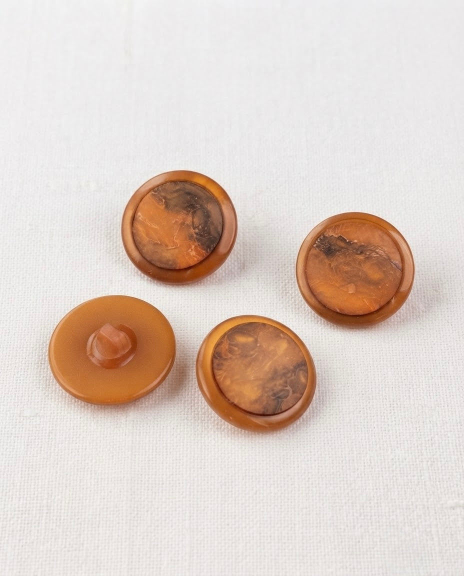 Boutons ronds cuivre à centre marbré de 22 mm, trois vus de face et un vu de dos
