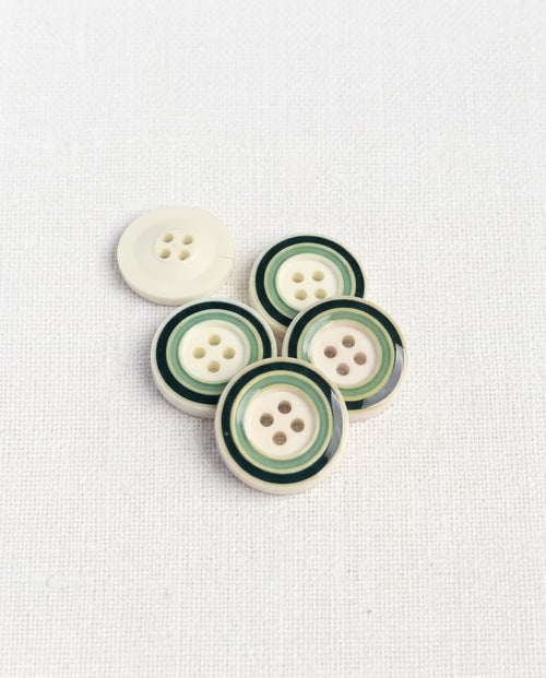 Cinq boutons ronds de 22 mm à 4 trous, fond crème et cercles vert foncé et vert d'eau, dont un vu de dos crème uni